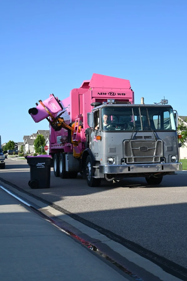 Dumpster Diverz truck collecting trash in Northern Colorado community